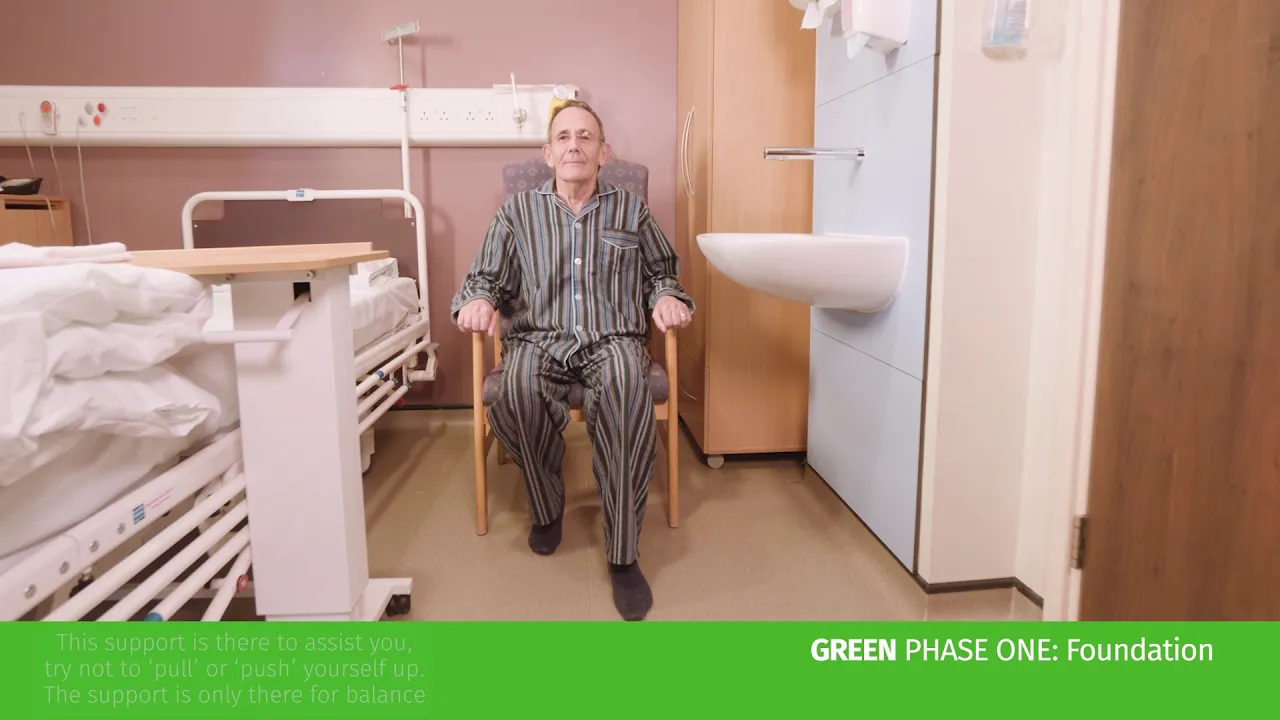 a man sitting in a hospital chair