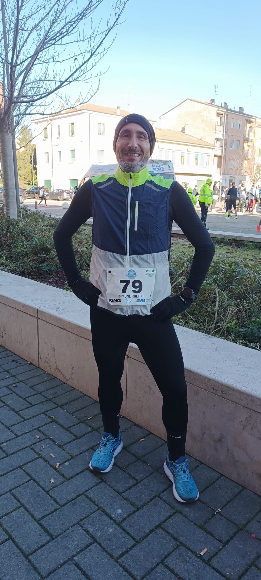 a person wearing a black shirt and running on a sidewalk
