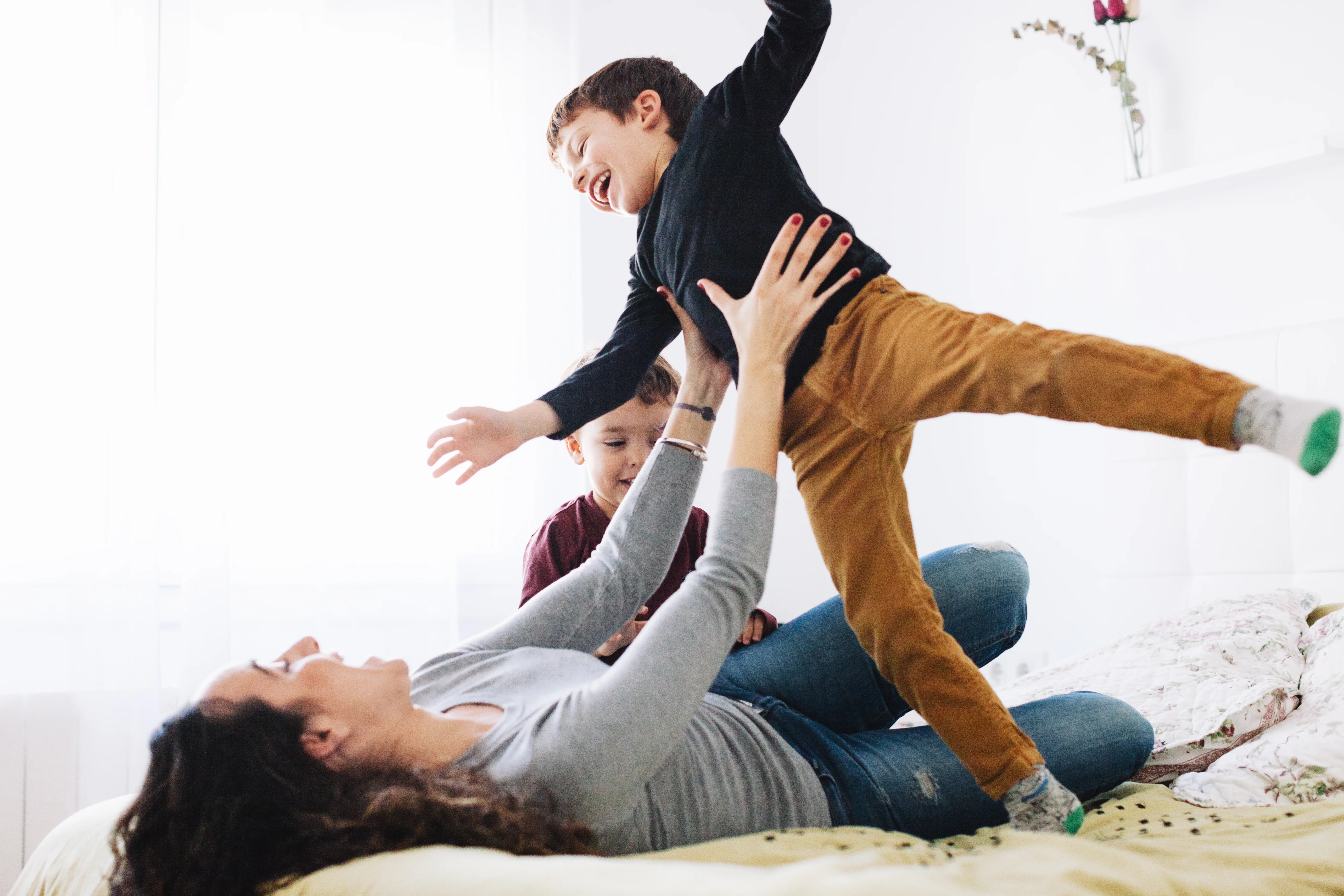 A woman is holding a child in her arms