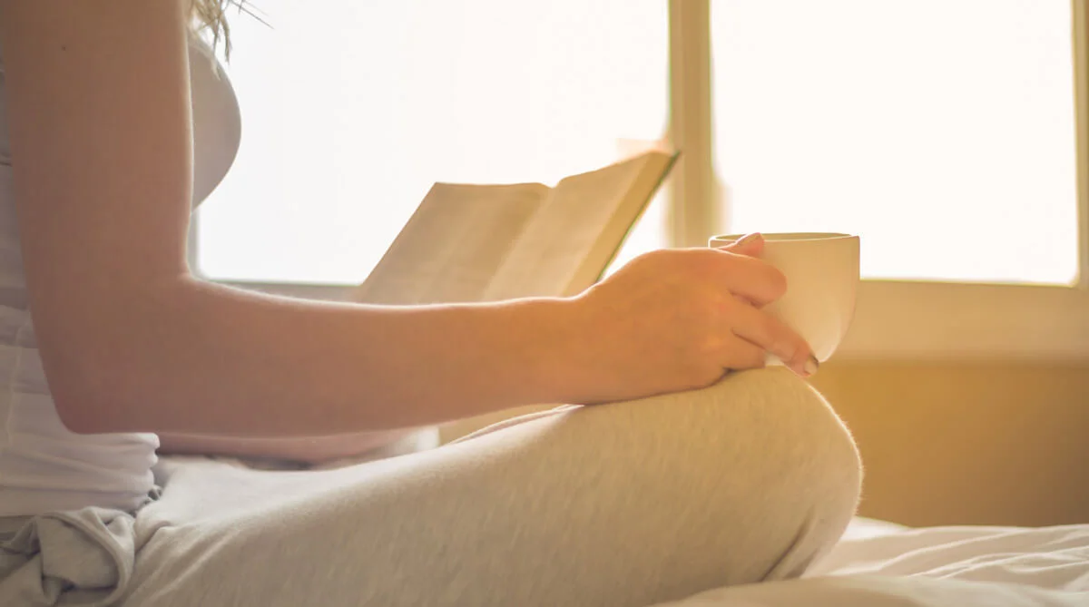 a person holding a cup