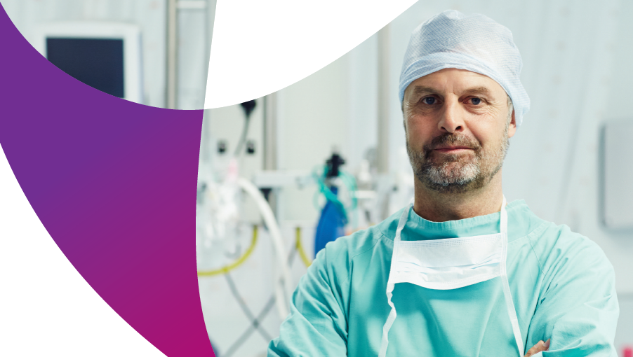 a surgeon looking down the camera in scrubs